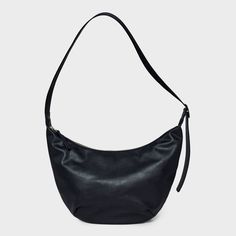 Bring a chic finishing touch to your everyday or dressy outfits with this Slouchy Crescent Sling Handbag from Universal Thread™. This unstructured handbag features a single zipper compartment to carry your phone, wallet, makeup essentials and other items. Plus, it has an interior zip pocket for any additional space you need. Designed in crescent shape and featuring a faux-suede finish in a solid hue, this handbag features an adjustable belt strap that make carrying it convenient and comfortable. Versatile Crossbody Baguette Bag With Zipper, Modern Leather Hobo Bag With Cell Phone Pocket, Elegant Bag With Cell Phone Pocket For Everyday Use, Elegant Everyday Bags With Cell Phone Pocket, Elegant Bags With Cell Phone Pocket, Modern Shoulder Bag Pouch With Cell Phone Pocket, Modern Shoulder Pouch With Cell Phone Pocket, Modern Black Hobo Bag With Zipper Pocket, Chic Hobo Bag With Cell Phone Pocket For Travel