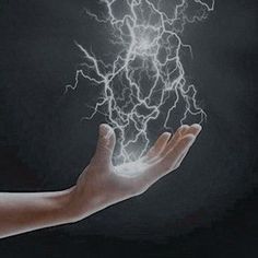 a person holding out their hand with some lightning in it