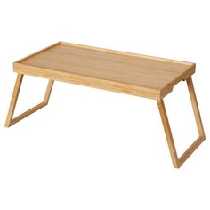 a wooden coffee table with two legs and a tray on the bottom that is bent down