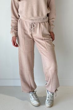 A must have pair of sweatpants to wear all year long! Our new Lounge Life Joggers feature an elastic tie waistband, seam detailing, drawstring bottoms, and side pockets. The perfect bottoms to just throw on and go! cotton polyester hand wash with cold water lay flat to dry do not iron Model is wearing a size small Trends 2025, Tailgate Outfit, State Necklace, Relaxed Trousers, Four Sisters, Eucalyptus Mint, Pink Lemon, Tank Bodysuit, Mocha Brown