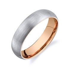 a yellow gold wedding ring on a white background