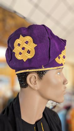 **Product Description: The Exquisite Eleburu Fila by Dupsie's African Fashion** Embrace the elegance of African fashion with the Eleburu Fila, a stunning purple with gold embroidery hat by Dupsie's African Fashion. This traditional Yoruba fila hat is meticulously handwoven from the finest Aso Oke fabric, embodying the rich heritage and craftsmanship of Nigerian fashion. Perfect for formal or special occasions, this versatile African hat can be styled in various ways to suit your unique fashion s Yoruba Cap Designs, African Dashiki Shirt, African Hat, African Tops For Women, African Pants, Kufi Hat, African Shoes, Embroidery Hat, Yoruba People