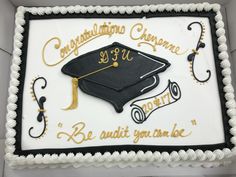 a graduation cake with congratulations written on it