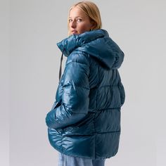 High Shine Puffer Jacket Center Front Hidden Zipper And Snap Closure Pillow Puff Hood With Drawcord Relaxed Fit Model Is 5'9 Wearing A Size S. Length: 28" Self: 100% Recycled Nylon Cire Lining: 100% Recycled Polyester Machine Wash Cold Separately, Tumble Dry Low Oversized Quilted Jacket For Cold Weather, Blue Nylon Winter Parka, Blue Down Puffer Jacket With Detachable Hood, Blue Nylon Parka For Winter, Winter Blue Quilted Jacket With Padded Collar, Blue Quilted Winter Jacket For Cold Weather, Blue Winter Quilted Jacket For Cold Weather, Puffy Down Outerwear For Cold Weather, Blue Nylon Winter Outerwear