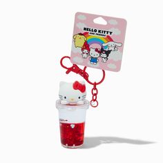 a hello kitty keychain in a plastic cup