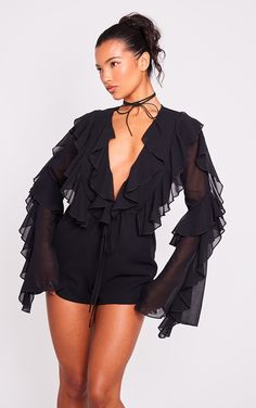 Get ready for the weekend with this black ruffle detail long sleeve plunge playsuit. Brought to you in a black hue material with ruffle detail and a plunging neckline, how could you say no Be prepared to turn heads for all the right reasons with this playsuit , you won't be able to resist it. Team with clear heels, a chocker and a mini bag for a flawless finish.   Length approx 79cm/31 (Based on a sample size UK 8)   Model wears size UK 8/ EU 36/ AUS 8/ US 4 Black Playsuit, Clear Heels, Sleeve Fashion, Black Romper, Black Ruffle, Black Jumpsuit, Plunging Neckline, Rompers Women, Model Height