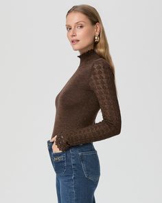 Made from our super soft peachskin yarn with metallic threads woven throughout, this brown long sleeve turtleneck top makes a subtle statement that we absolutely love. Detailed with a small ruffle at the neckline and pointelle stitching on the sleeves, the Stephanie Top offers the perfect amount of shine for an effortlessly elevated look. | Stephanie Top - Bronze Sparkle | Size Medium Fall Mock Neck Top For Night Out, Fitted Mock Neck Top For Fall Party, Fall Mock Neck Turtleneck Top For Night Out, Elegant Long Sleeve Turtleneck Top For Spring, Elegant Brown Turtleneck For Fall, Brown Fall Top For Night Out, Brown Tops For Fall Night Out, Brown Top For Night Out In Fall, Elegant Brown Stretch Top