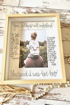 a framed photo with the words, you're father will be important and she said i was not pretty