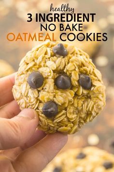 a hand holding an oatmeal cookie with chocolate chips in it and the words healthy 3 ingredient no bake oatmeal cookies