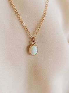 Opal pendant necklace gold White Oval Opal Necklace, White Opal Necklace With Delicate Chain, Handmade Dainty Opal Necklace, Ethiopian Opal Birthstone Necklace For Gift, Dainty Opal Round Pendant Necklace, Opal Jewelry With Delicate Chain As Gift, Delicate Opal Chain Jewelry As Gift, Delicate Opal Chain Jewelry Gift, Delicate Opal Chain Jewelry For Gifts