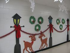 some christmas decorations are hanging on the wall