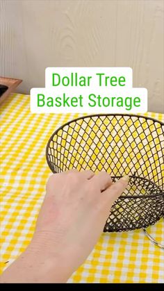 a person is holding a wire basket with the words dollar tree basket storage