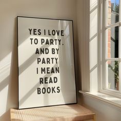 there is a poster on the wall next to a window that says yes i love to party and by party i mean read books