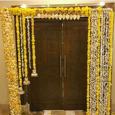 an entrance decorated with yellow and white flowers