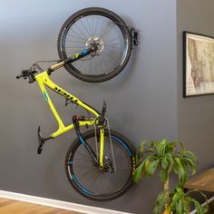 wall mount bike hook Bike Wall Storage, Bike Storage Design, Wall Mounted Bike Storage, Rack Velo, Vertical Bike Rack, Bike Storage Garage, Bike Rack Wall, Bike Wall Mount, Bike Hanger