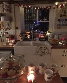 a kitchen filled with lots of food and candles