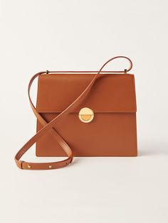 Objets Daso Tan Leather Hye Handbag: Front View with Shoulder Strap On Top Finishing Materials, Modern Life, South Korean, Volume 1, Tan Leather, Gold Finish, Calf Skin, Leather Straps, Shoulder Strap