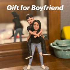 a man and woman figurine sitting on top of a table with the words gift for boyfriend