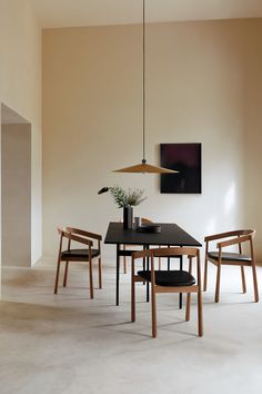 a black table and chairs in a room