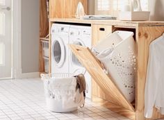 a washer and dryer sitting in a room next to each other on the floor