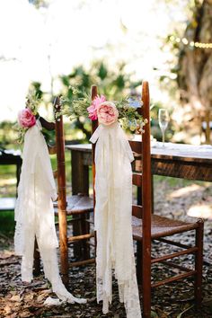 an image of two brides with flowers on their heads and veils tied to them