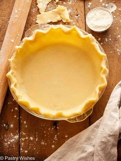 an uncooked pie crust on a wooden table