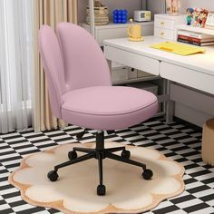 a pink office chair sitting on top of a white rug in front of a desk