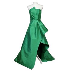 Elliatt Protea Gown In Emerald Green Size Small Brand New Waist 27" Bust 31"-32" Polyester Blend Dry Clean Recommended Partially Lined Hidden Back Zipper Closure With Faux Button Overlay Cinched Waist With Exaggerated Fabric Overlay Satin Fabric With Subtle Sheen Finish Neckline To Hem Measures Approx 63" In Length (5) Green Pre-draped Evening Gown, Green Pre-draped Evening Dress With Fitted Bodice, Pre-draped Green Evening Dress With Fitted Bodice, Green Pre-draped Evening Dress For Formal Events, Green Sleeveless Cocktail Gown, Green Satin Cocktail Gown, Pre-draped Sleeveless Green Evening Dress, Formal Green Gown With Sweep Train, Green Silk Maxi Dress With Fitted Bodice