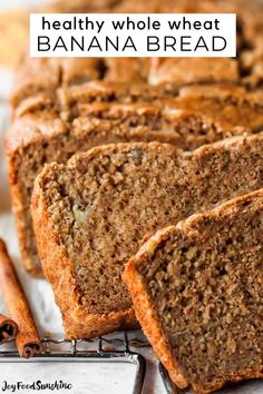 slices of healthy whole wheat banana bread on a cooling rack with cinnamon sticks next to it