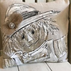 a pillow with a drawing of a scarecrow on it