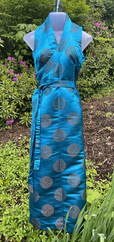 Tibetan Chuba Dress: Beautiful, Elegant and comfortable. Tibetan Chubas are traditionally worn by woman all around the world for all occasions. Blouse does not come with Chuba. Made in Nepal from Silk. All size are approximate Size: Small, Medium, Large XL Bust: 34" 38" 40" 44" Waist: 34" 37" 39" 42" Length: 51" 54" 56" 58" Chuba Dress, Tibetan Chuba, Tibetan Clothes, Tibetan Dress, Tibetan Clothing, Women Scarves, Silk Brocade, Cotton Gifts, House Dress