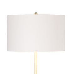 a lamp with a white shade on the base and a gold colored metal rod around it