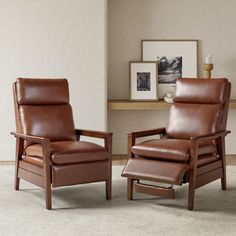 two brown leather recliners sitting next to each other