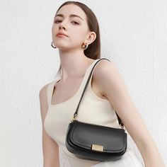 Discover Elegance and Functionality Embrace timeless style with our Genuine Leather Crossbody Shoulder Bag. Designed for the modern woman who appreciates sophistication without sacrificing functionality, this bag is a testament to classic European and American retro designs. Available in chic black, warm khaki, and elegant beige, this versatile accessory is perfect for any occasion. Exceptional Quality and Design Crafted from high-quality second layer cowhide, the bag's texture is both visually appealing and durable. The solid pattern and hard box shape ensure that your belongings are protected and organized, while the hasp closure secures them stylishly. Its small square size makes it an ideal choice for those who value light and efficient travel. Product Features Type: Shoulder & Crossbo Saddle Handbags, Lock Style, Retro Mode, Crossbody Shoulder Bag, Leather Fashion, Saddle Bags, Modern Woman, Stylish Women, Evening Bags