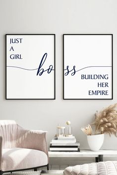 two posters with the words just a girl and building her empire on them in a living room