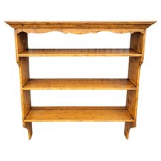 a wooden shelf with three shelves on each side and one shelf above the other, against a white background