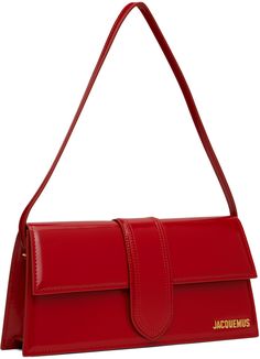 Structured patent calfskin shoulder bag in red. · Fixed shoulder strap · Logo hardware at face · Patch pocket at back face · Magnetic flap · Patch pocket at interior · Cotton twill lining · Logo-engraved gold-tone hardware · H5.25 x W11 x D2.5 Part of the Le Chouchou collection. Supplier color: Red Classic Red Bag With Glossy Finish, Red Leather Bags With Glossy Finish, Formal Red Bag With Glossy Finish, Formal Red Bags With Glossy Finish, Red Glossy Formal Bags, Rectangular Leather Shoulder Bag With Glossy Finish, Rectangular Patent Leather Shoulder Bag With Glossy Finish, Glossy Patent Leather Rectangular Shoulder Bag, Rectangular Glossy Patent Leather Shoulder Bag