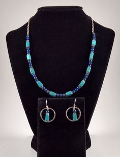 Turquoise, Sodalite, and Sterling Silver necklace and earring set. The necklace is approximately 18 inches in length. Can be made shorter upon request. The beaded portion of the necklace is approximately 9.5 inches in length. The necklace is finished with Sterling Silver twisted rope chain and a handmade clasp. The earrings are framed with Sterling Silver drops approximately one inch in length. The 22 gauge earwires are approximately one inch in length. Blue Sterling Silver Single Strand Jewelry, Turquoise Lapis Lazuli Jewelry Gift, Turquoise Lapis Lazuli Jewelry For Gift, Turquoise Lapis Lazuli Beaded Jewelry, Adjustable Blue Southwestern Necklace, Turquoise Lapis Lazuli Gemstone Beads Jewelry, Turquoise Lapis Lazuli Round Bead Jewelry, Hand-strung Turquoise Necklace With Sterling Silver Round Beads, Southwestern Style Hand-strung Blue Beaded Necklaces