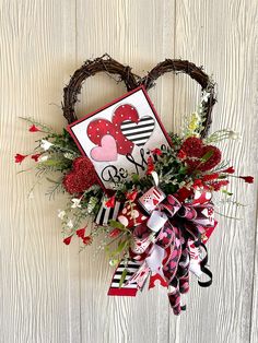 a valentine's day wreath hanging on the wall