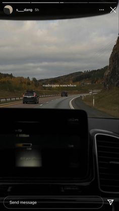 a car driving down the road in front of another car on it's dashboard