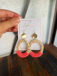 These coral beaded and gold rattan drops earrings are the perfect accessory for the summer season. Crafted with quality handmade beads and rattan, they will bring a splash of color and sparkle to any outfit. Lightweight and comfortable, you can wear these bold earrings all day long. 2.7” Lead and nickel free Gold Earrings For Beach Spring Season, Handwoven Gold Earrings For Summer, Gold Beaded Earrings For Beach, Gold Beaded Earrings For Summer, Trendy Coral Jewelry For Summer, Trendy Coral Summer Jewelry, Spring Vacation Woven Jewelry, Pink Beaded Earrings With Round Beads For Beach, Pink Round Beaded Earrings For Beach