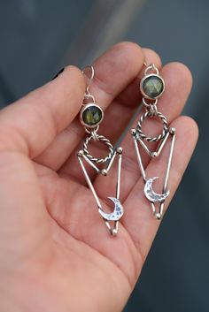 Handmade unique labradorite earrings made in sterling silver. The earrings are approx. 8 cm long (with the hooks) Every jump ring in these earrings are soldered and nothing will fall off. Everything in my shop is handmade by myself in my little studio. I put a lot of time and love into my work and I love to be an artist. If you have some questions please send me a message!! ----------- Handmade Labradorite earrings with texture. The earrings are approximately 8 cm long (measured with the ear hoo Bold Statement Jewelry, Silversmith Jewellery, Edgy Jewelry, Witchy Jewelry, Labradorite Earrings, Gemstone Jewelry Handmade, Moon Jewelry, Silver Jewelry Handmade, Silver Moon