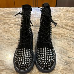 Wild Pair Studded Combat Boots, Brand New, Never Worn, Color Is Black With Silver Studs, Size Is 6.5 Women’s, Zips Up & Down In The Inside To Make It Easy Getting Your Foot In And Out. That Way You Don’t Have To Lace It Up Every Time. Edgy Silver Boots With Studs, Edgy Silver Studded Boots, Trendy Boots With Silver Studs And Round Toe, High Heel Silver Boots With Silver Studs, Edgy Silver Boots With Round Toe, Edgy Silver Round Toe Boots, Silver Boots With Metal Feet For Night Out, Silver Boots With Rivets And Round Toe, Silver Punk Boots With Rivets