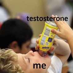 a young boy drinking from a can with the caption teetosterone me