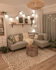 a living room filled with furniture and decor on top of a white carpeted floor