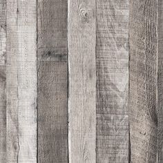 wood planks are painted white and grey with some brown spots on the top one