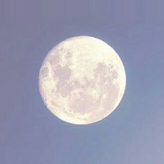 an airplane flying in front of the moon