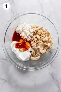 ingredients in a glass bowl to make chicken salad