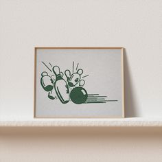 a green and white print on a shelf