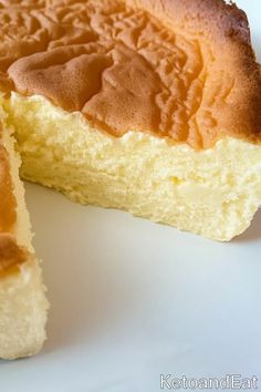 a close up of a piece of cake on a plate with one slice cut out